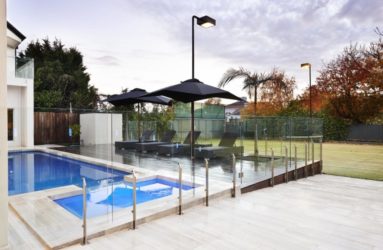 Thump glass pool fence on property